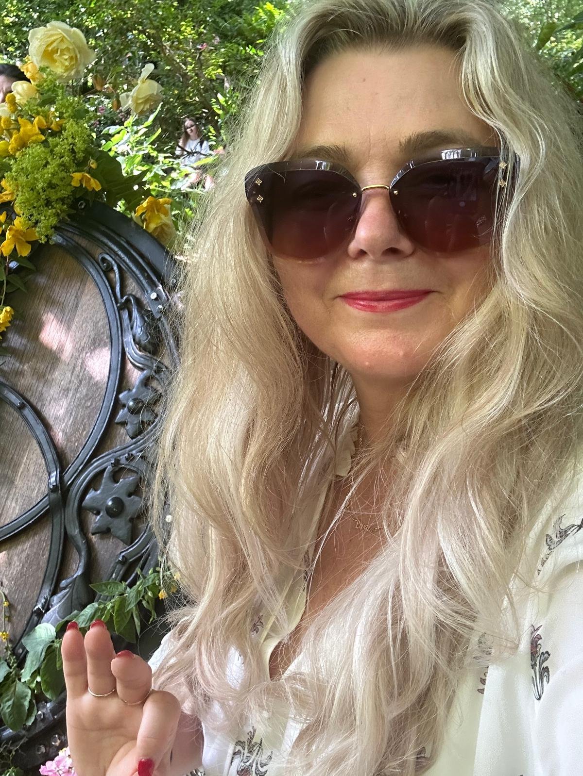 Smiling among yellow roses