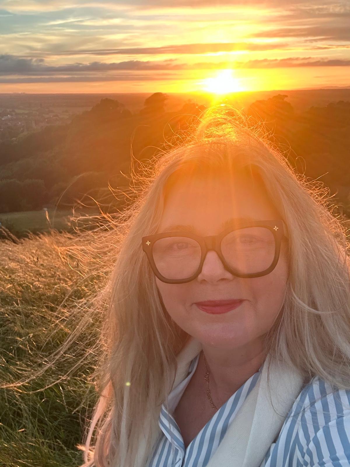 The Galactic High Priestess bathed in golden sunset light